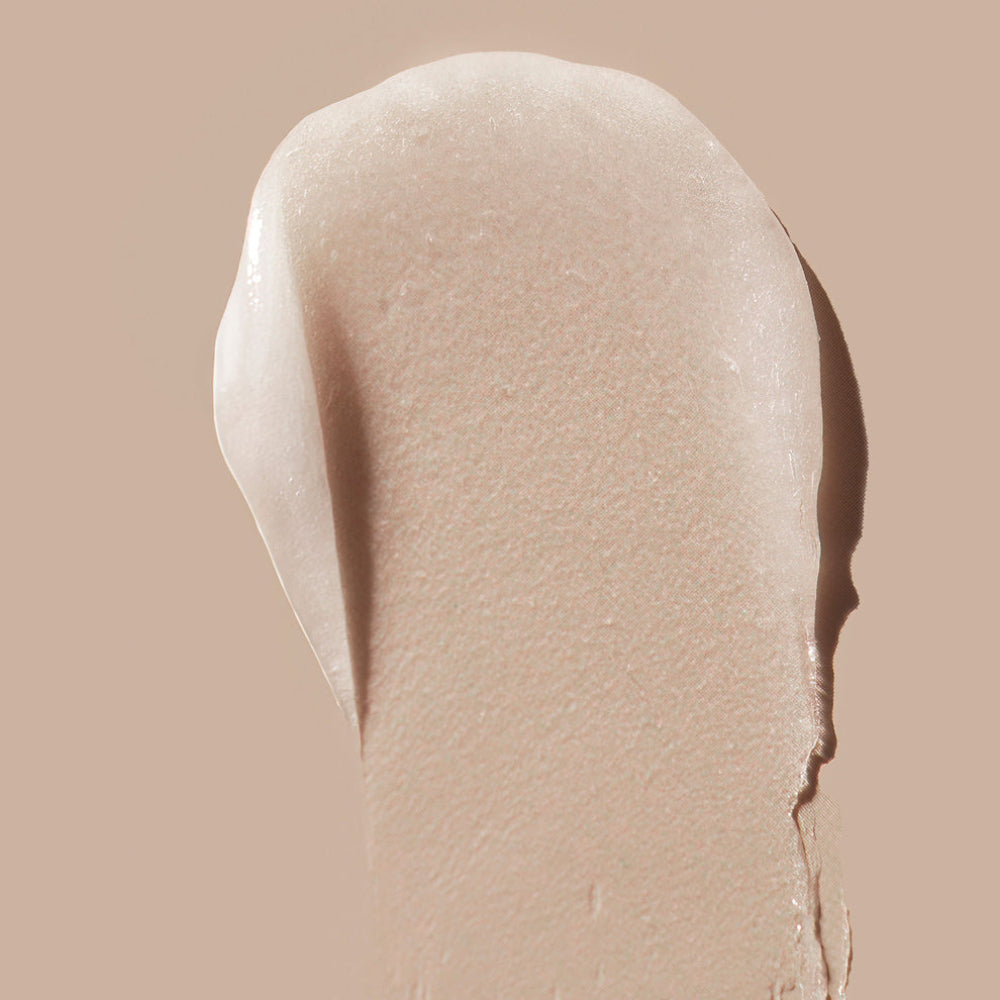 Beige cosmetic cream swatch on a beige background
