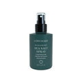 Green spray bottle of Löwengrip Sea Salt Spray on a white background