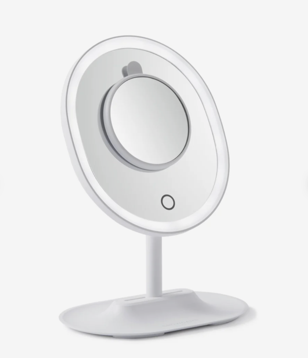 White vanity mirror with LED lights on a white background