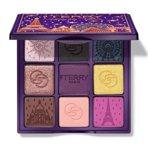 Makeup palette with colorful eyeshadows and By Terry branding on a white background