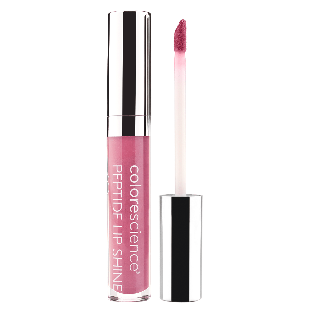 Colorescience lip gloss with applicator on a green background