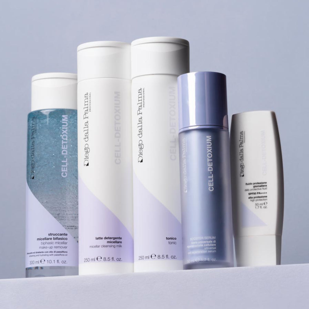 Collection of skincare products on a gray background