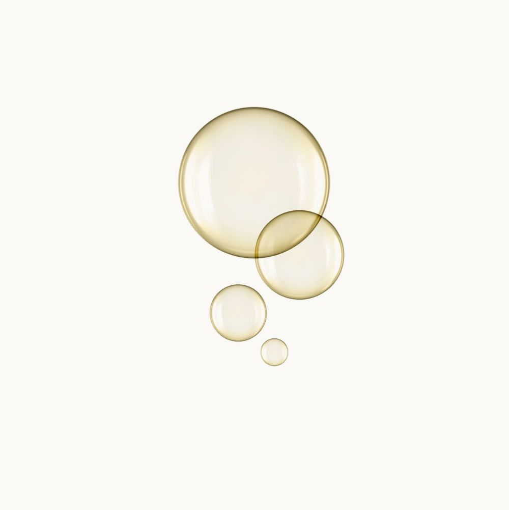 Three gold bubbles of different sizes on a white background