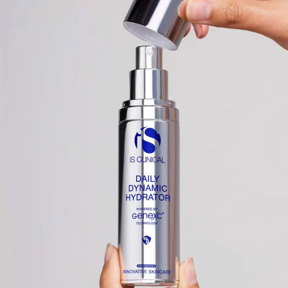 IS Clinical Daily Dynamic Hydrator bottle with a hand opening it on a gray background