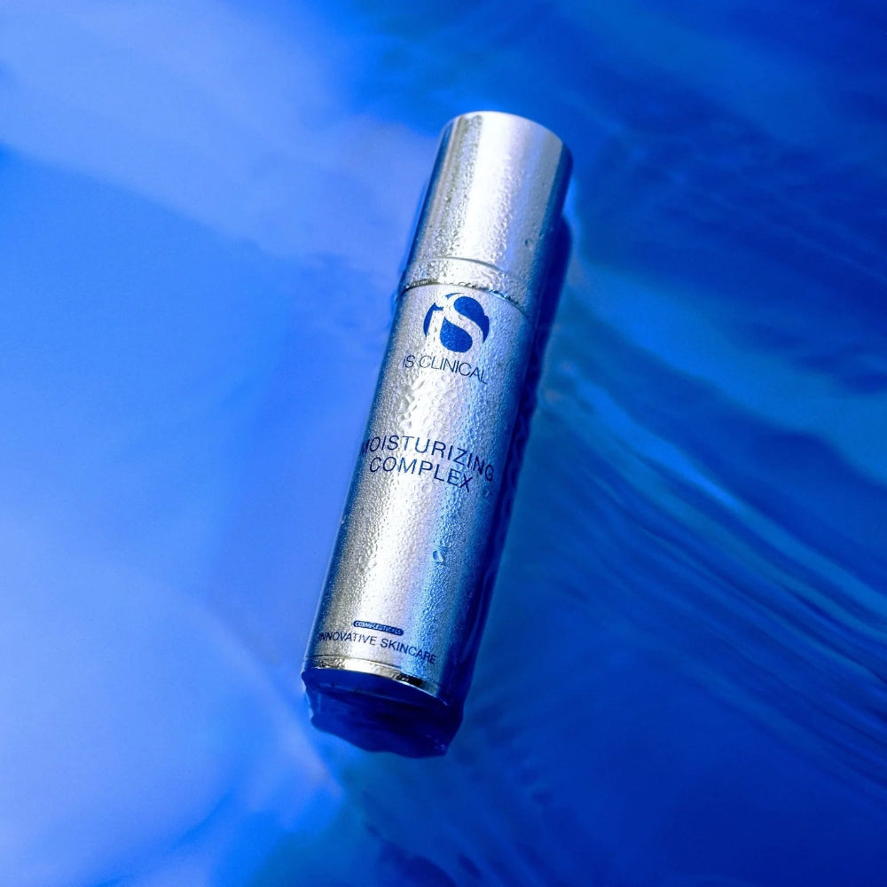 Skincare serum bottle labeled 'N. Clinical' on a blue water background