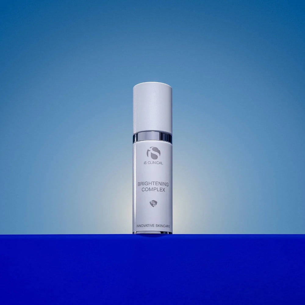 Skincare serum bottle on a gradient blue background