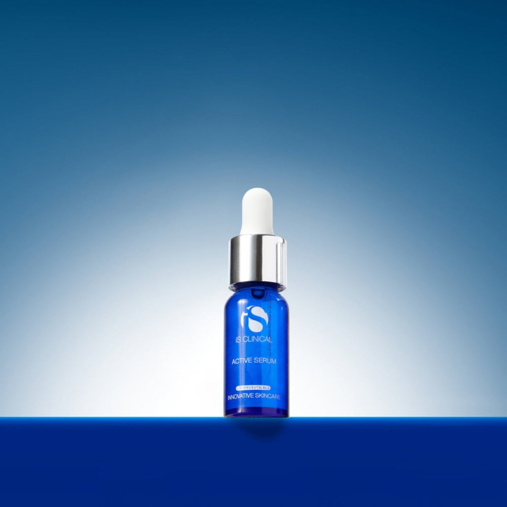 Blue skincare serum bottle with dropper on a gradient blue background