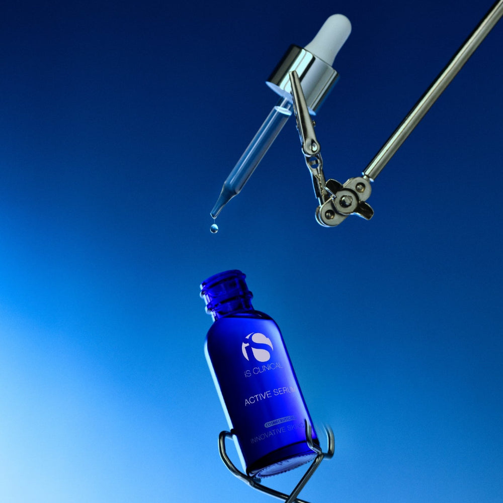 Blue dropper bottle with a dropper on a blue background