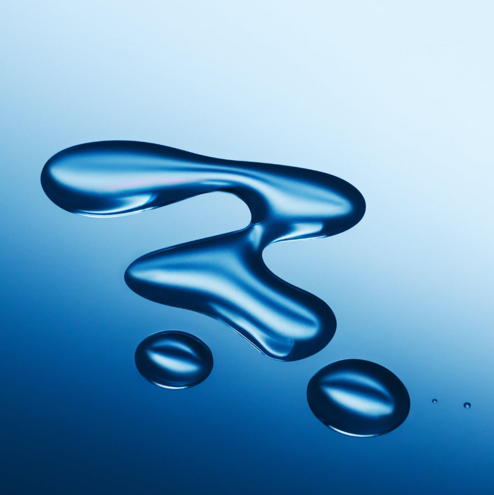 Blue liquid droplet on a reflective blue surface